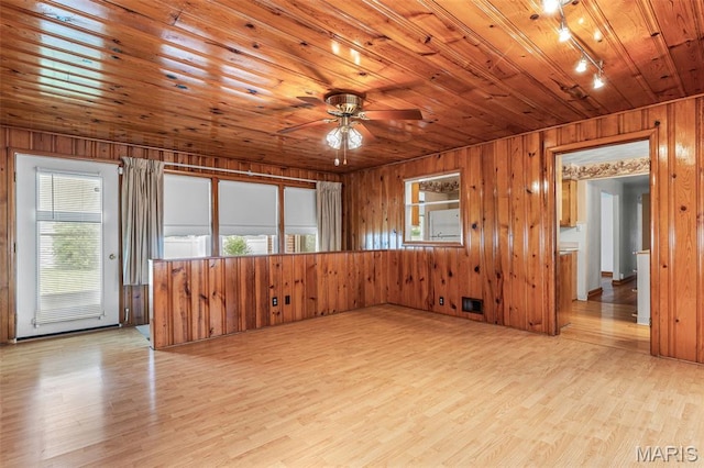 715 S A St, Farmington, MO 63640 - unfurnished room with plenty of natural light, wood walls, ceiling fan, wood ceiling, and light wood-style flooring