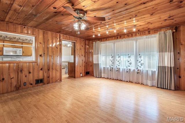 715 S A St, Farmington, MO 63640 - spare room with wood ceiling, wood finished floors, ceiling fan, and wood walls