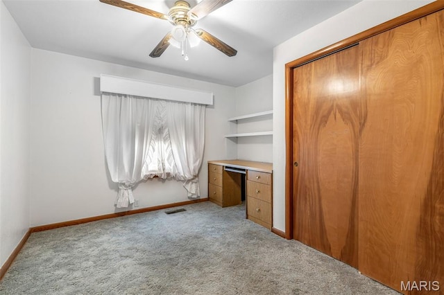 715 S A St, Farmington, MO 63640 - unfurnished bedroom with carpet floors, a closet, a ceiling fan, and an office area