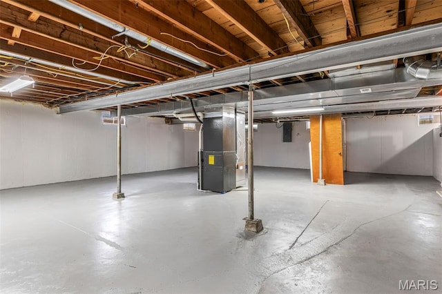 715 S A St, Farmington, MO 63640 - unfinished basement featuring heating unit and electric panel