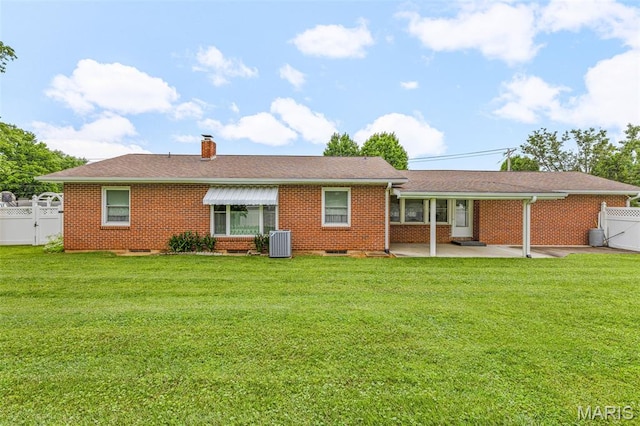 715 S A St, Farmington, MO 63640 - rear view of house featuring a gate, a patio, a chimney, and brick siding