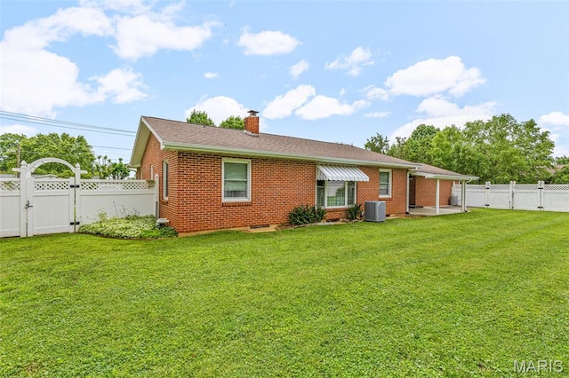 715 S A St, Farmington, MO 63640 - rear view of property with a gate, a fenced backyard, a chimney, and brick siding