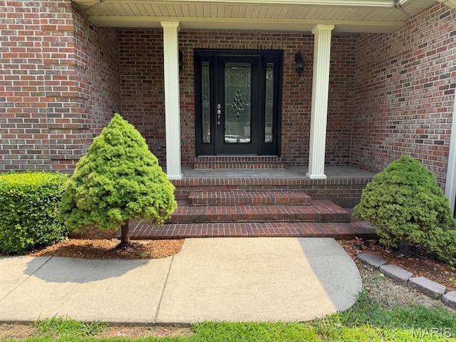 17138 E Cedar Hills Dr, Dexter, MO 63841 - doorway to property with a porch and brick siding