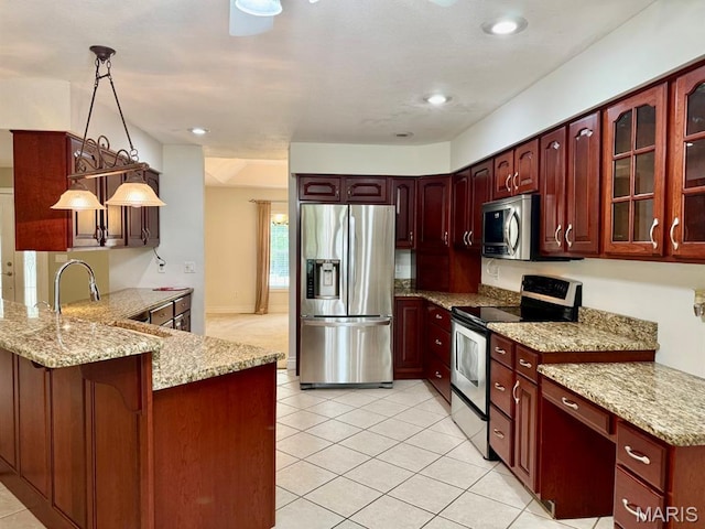 17138 E Cedar Hills Dr, Dexter, MO 63841 - kitchen with stainless steel appliances, a peninsula, light tile patterned flooring, light stone counters, and recessed lighting