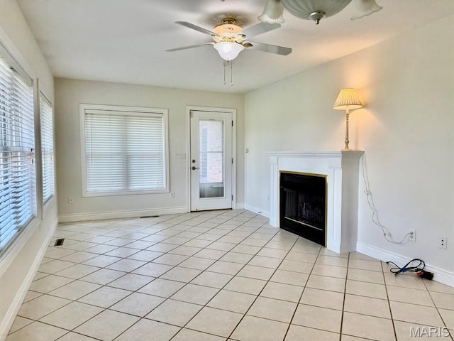 17138 E Cedar Hills Dr, Dexter, MO 63841 - unfurnished living room with a fireplace, light tile patterned floors, and ceiling fan