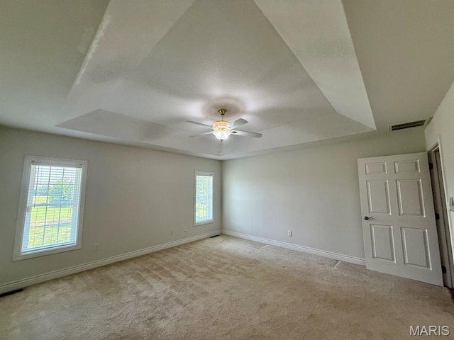 17138 E Cedar Hills Dr, Dexter, MO 63841 - carpeted empty room featuring a raised ceiling and ceiling fan