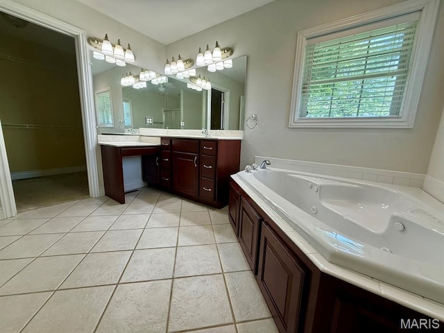 17138 E Cedar Hills Dr, Dexter, MO 63841 - full bath with healthy amount of natural light, vanity, a jetted tub, and tile patterned floors