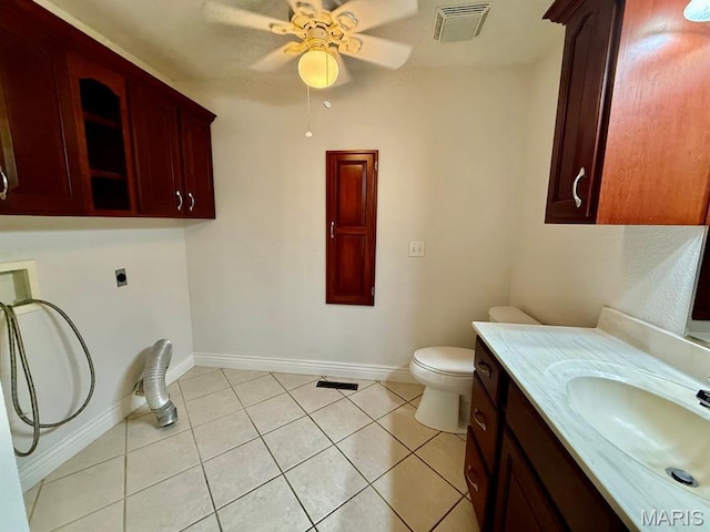 17138 E Cedar Hills Dr, Dexter, MO 63841 - bathroom with ceiling fan, vanity, and tile patterned flooring