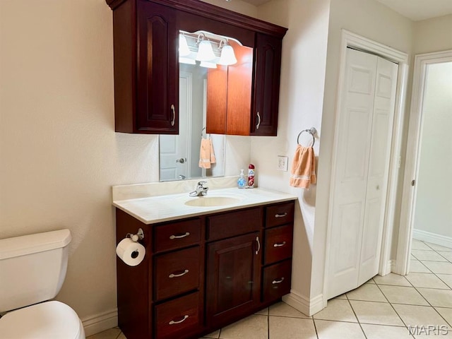 17138 E Cedar Hills Dr, Dexter, MO 63841 - bathroom with a closet, vanity, and tile patterned flooring