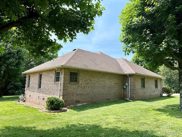 17138 E Cedar Hills Dr, Dexter, MO 63841 - view of home's exterior with crawl space, a yard, brick siding, and roof with shingles