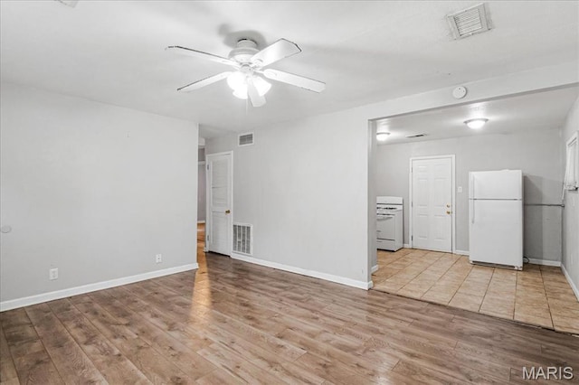 14 Lillian Dr, Belleville, IL 62226 - unfurnished living room with a ceiling fan and light wood-type flooring