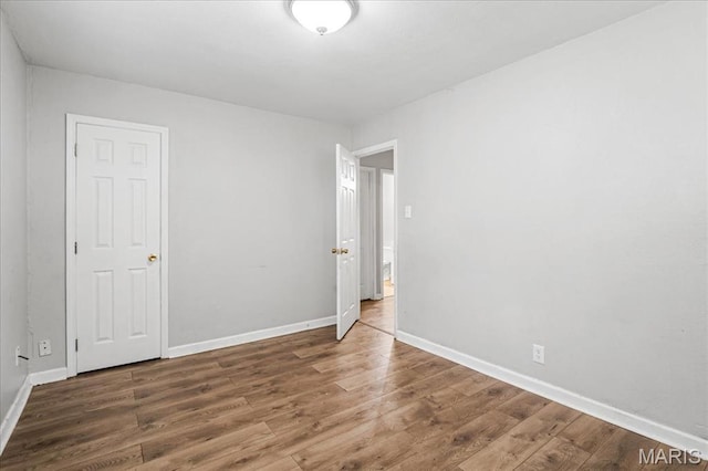 14 Lillian Dr, Belleville, IL 62226 - empty room with wood finished floors and baseboards