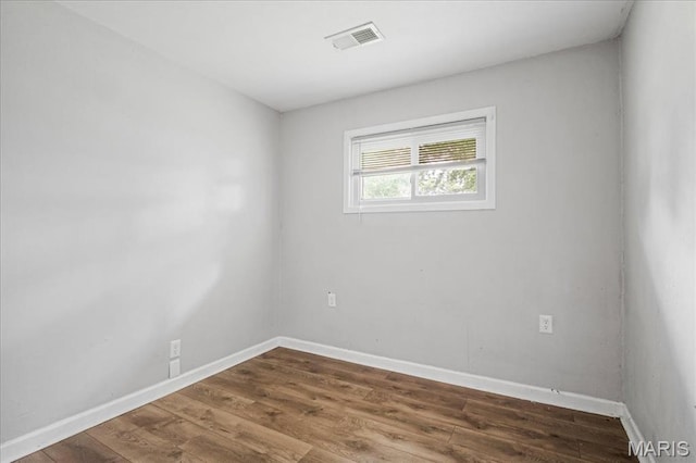 14 Lillian Dr, Belleville, IL 62226 - empty room with wood finished floors and baseboards