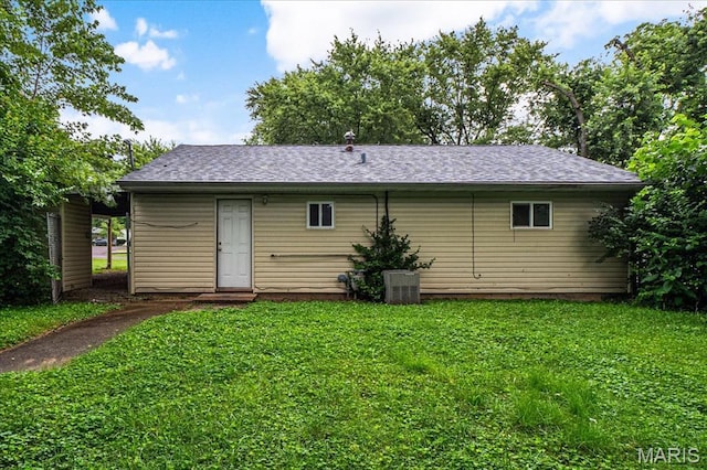 14 Lillian Dr, Belleville, IL 62226 - back of house with a lawn and a shingled roof