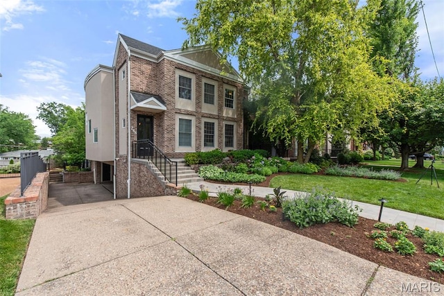 248 Gay Ave, Clayton, MO 63105 - view of front of property with brick siding, concrete driveway, a front yard, and stucco siding