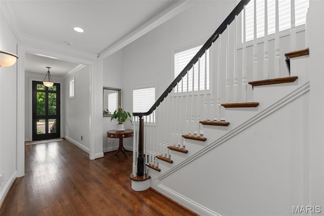 248 Gay Ave, Clayton, MO 63105 - entryway with ornamental molding, wood finished floors, stairway, and recessed lighting
