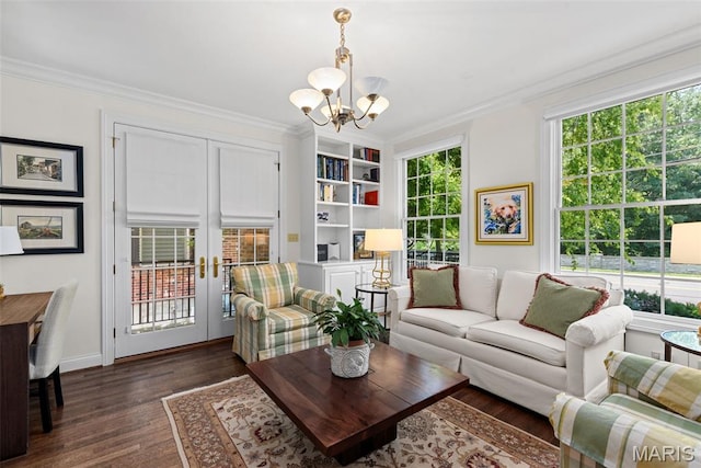 248 Gay Ave, Clayton, MO 63105 - living area featuring a chandelier, crown molding, dark wood-type flooring, built in shelves, and french doors