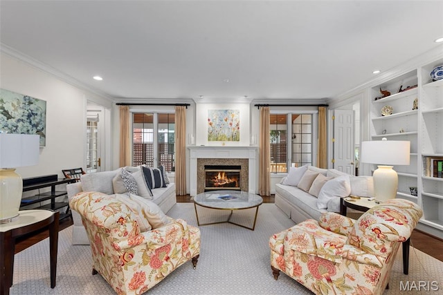 248 Gay Ave, Clayton, MO 63105 - living area featuring ornamental molding, a lit fireplace, built in shelves, and recessed lighting