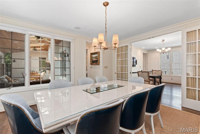 248 Gay Ave, Clayton, MO 63105 - dining room with a chandelier, wood finished floors, and ornamental molding