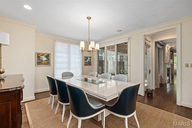 248 Gay Ave, Clayton, MO 63105 - dining space with a chandelier, dark wood finished floors, and crown molding