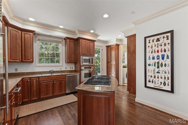 248 Gay Ave, Clayton, MO 63105 - kitchen with appliances with stainless steel finishes, ornamental molding, dark wood-style flooring, a center island, and healthy amount of natural light