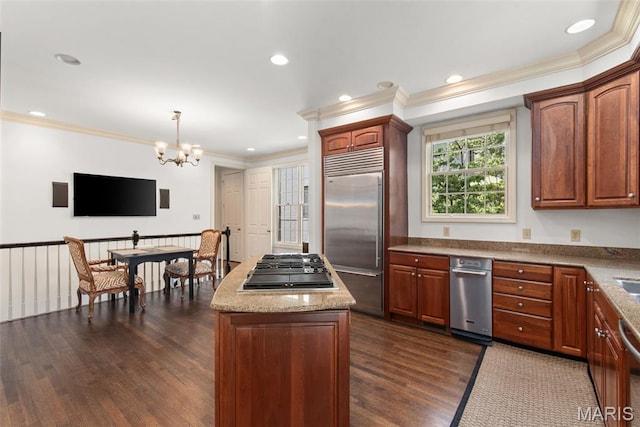 248 Gay Ave, Clayton, MO 63105 - kitchen with appliances with stainless steel finishes, crown molding, dark wood-style floors, a kitchen island, and a chandelier