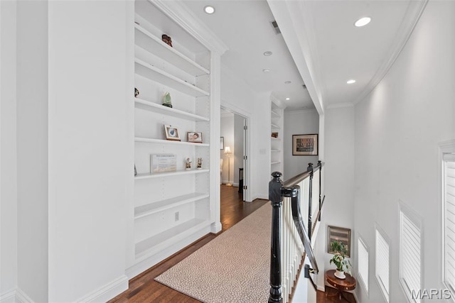 248 Gay Ave, Clayton, MO 63105 - corridor with dark wood-type flooring, an upstairs landing, recessed lighting, built in shelves, and ornamental molding