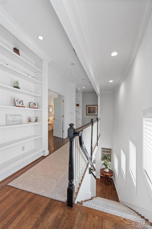 248 Gay Ave, Clayton, MO 63105 - stairs with wood finished floors, crown molding, built in features, and recessed lighting