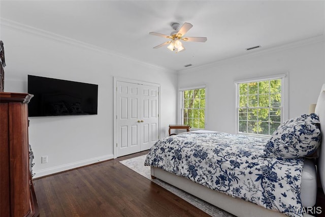 248 Gay Ave, Clayton, MO 63105 - bedroom featuring dark wood-style floors, ornamental molding, a closet, and a ceiling fan