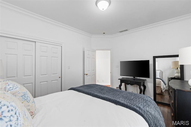 248 Gay Ave, Clayton, MO 63105 - bedroom featuring dark wood-style floors, ornamental molding, and a closet