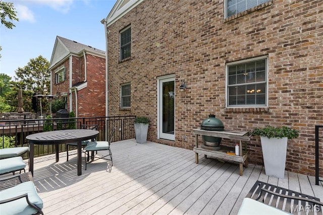 248 Gay Ave, Clayton, MO 63105 - wooden deck featuring outdoor dining space