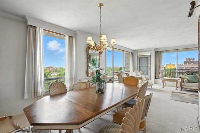 4501 Lindell Blvd Unit 9A, Saint Louis, MO 63108 - dining room with a chandelier, carpet floors, and crown molding