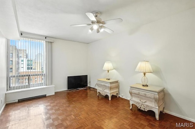 4501 Lindell Blvd Unit 9A, Saint Louis, MO 63108 - living area featuring baseboards and a ceiling fan