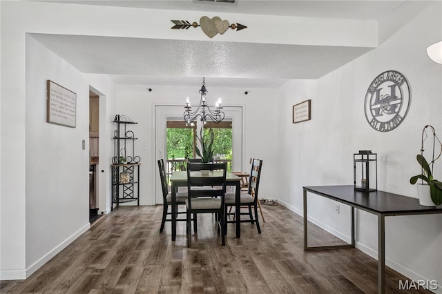 1939 Grandview Dr, Cape Girardeau, MO 63701 - dining room featuring a chandelier, dark wood-style flooring, and a textured ceiling