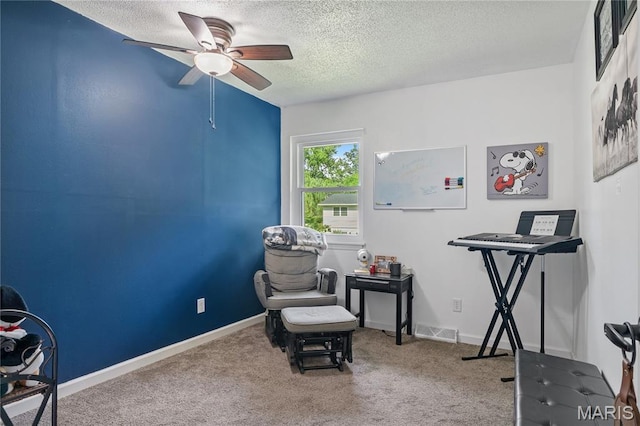 1939 Grandview Dr, Cape Girardeau, MO 63701 - living area featuring a ceiling fan, a textured ceiling, and carpet