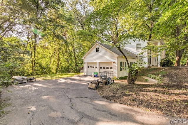 67 Kings Dr, Florissant, MO 63034 - view of front of property featuring asphalt driveway