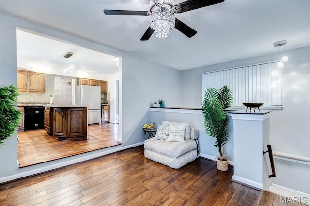 67 Kings Dr, Florissant, MO 63034 - sitting room featuring hardwood / wood-style floors, a ceiling fan, and an upstairs landing