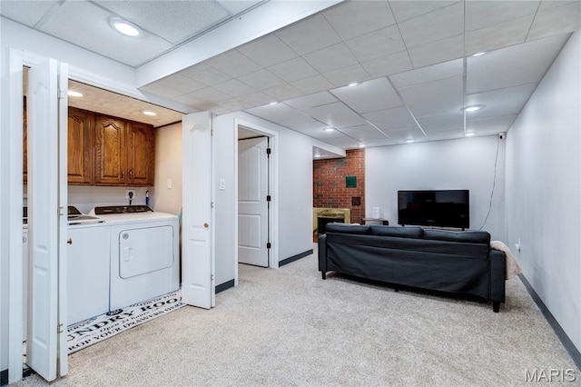 67 Kings Dr, Florissant, MO 63034 - living room featuring washing machine and dryer, light carpet, and a brick fireplace