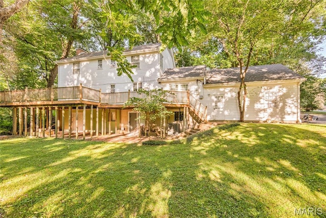 67 Kings Dr, Florissant, MO 63034 - rear view of house featuring a deck, stairway, a lawn, and a chimney