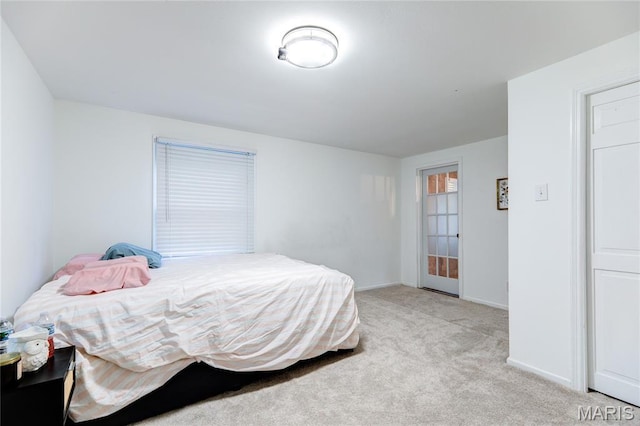 67 Kings Dr, Florissant, MO 63034 - bedroom featuring light carpet