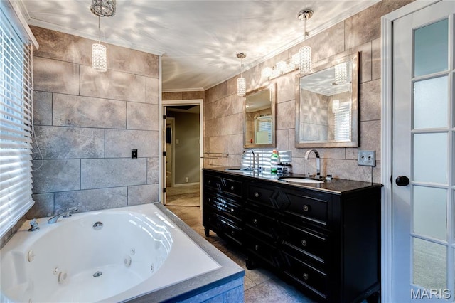 67 Kings Dr, Florissant, MO 63034 - full bath featuring tile walls, crown molding, double vanity, and a whirlpool tub