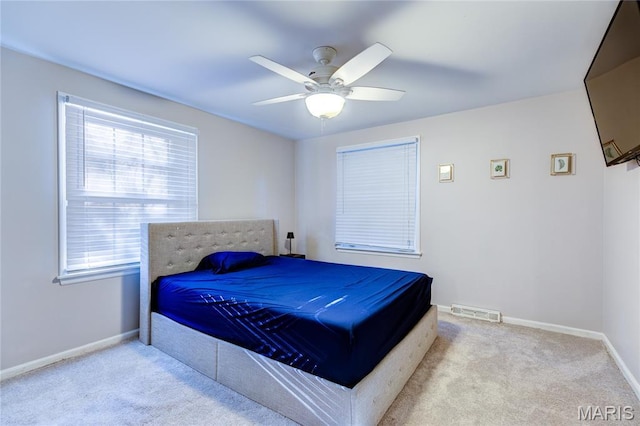 67 Kings Dr, Florissant, MO 63034 - bedroom with carpet floors, multiple windows, and a ceiling fan