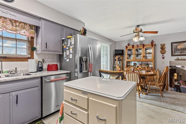 1301 Camillia St, Farmington, MO 63640 - kitchen featuring appliances with stainless steel finishes, ceiling fan, light countertops, and gray cabinets