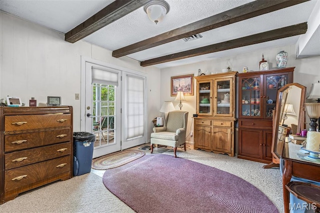 1301 Camillia St, Farmington, MO 63640 - living area with light carpet and beamed ceiling