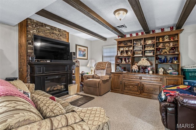1301 Camillia St, Farmington, MO 63640 - living room featuring beam ceiling, a textured ceiling, a large fireplace, and carpet floors