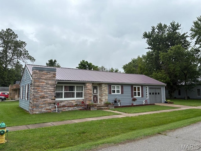422 W Dover St, Monroe City, MO 63456 - single story home featuring a garage, a metal roof, a front yard, driveway, and stone siding