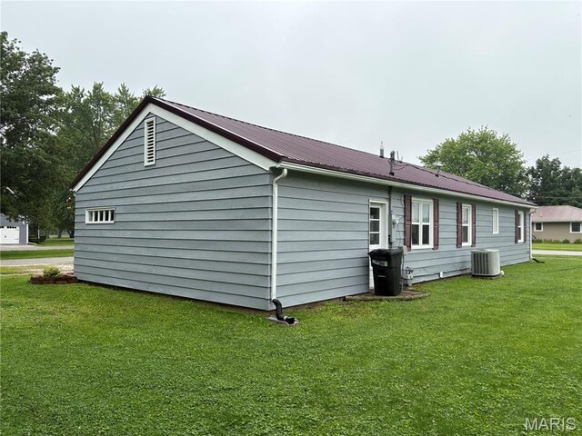 422 W Dover St, Monroe City, MO 63456 - view of property exterior with a metal roof and a lawn