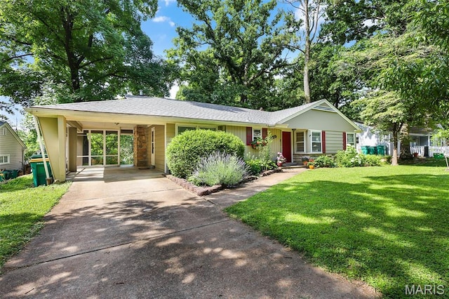 450 Forest Green Dr, Webster Groves, MO 63119 - single story home featuring concrete driveway, a front yard, and an attached carport