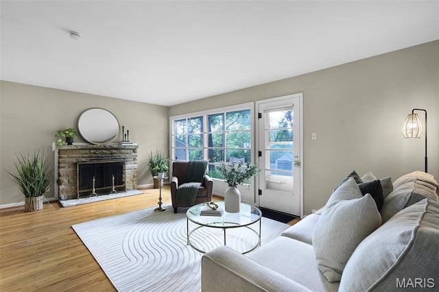450 Forest Green Dr, Webster Groves, MO 63119 - living room with a stone fireplace and wood finished floors