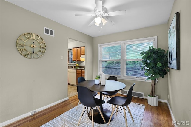 450 Forest Green Dr, Webster Groves, MO 63119 - dining space with light wood-style floors and ceiling fan